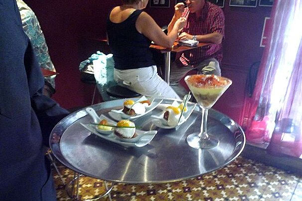 a photo of a waier with tapas in palma de majorca