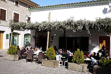 a photo of people seated at an out door cafe in mancor de la vall