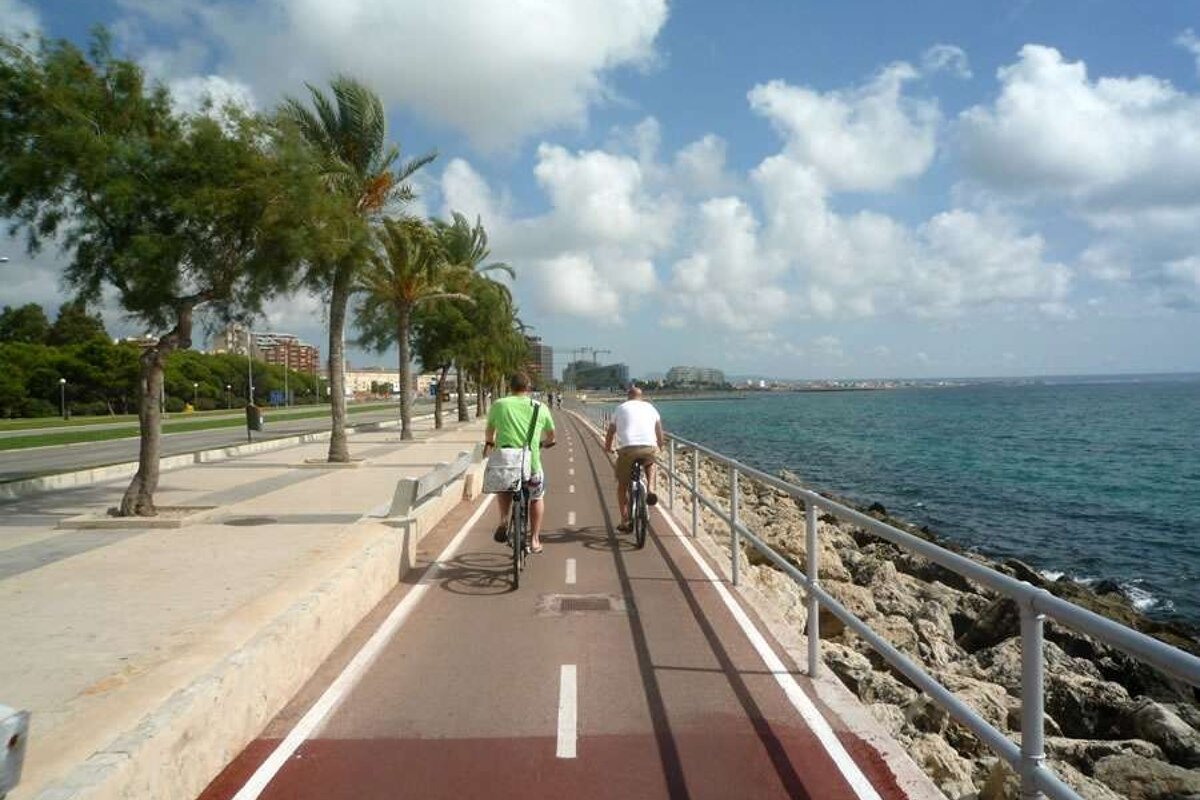 a photo of two cyclists on a cycle path in palma majorca
