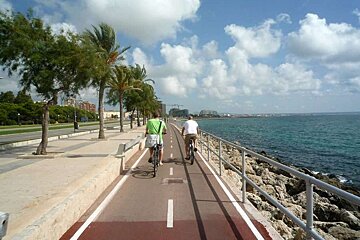 a photo of two cyclists on a cycle path in palma majorca