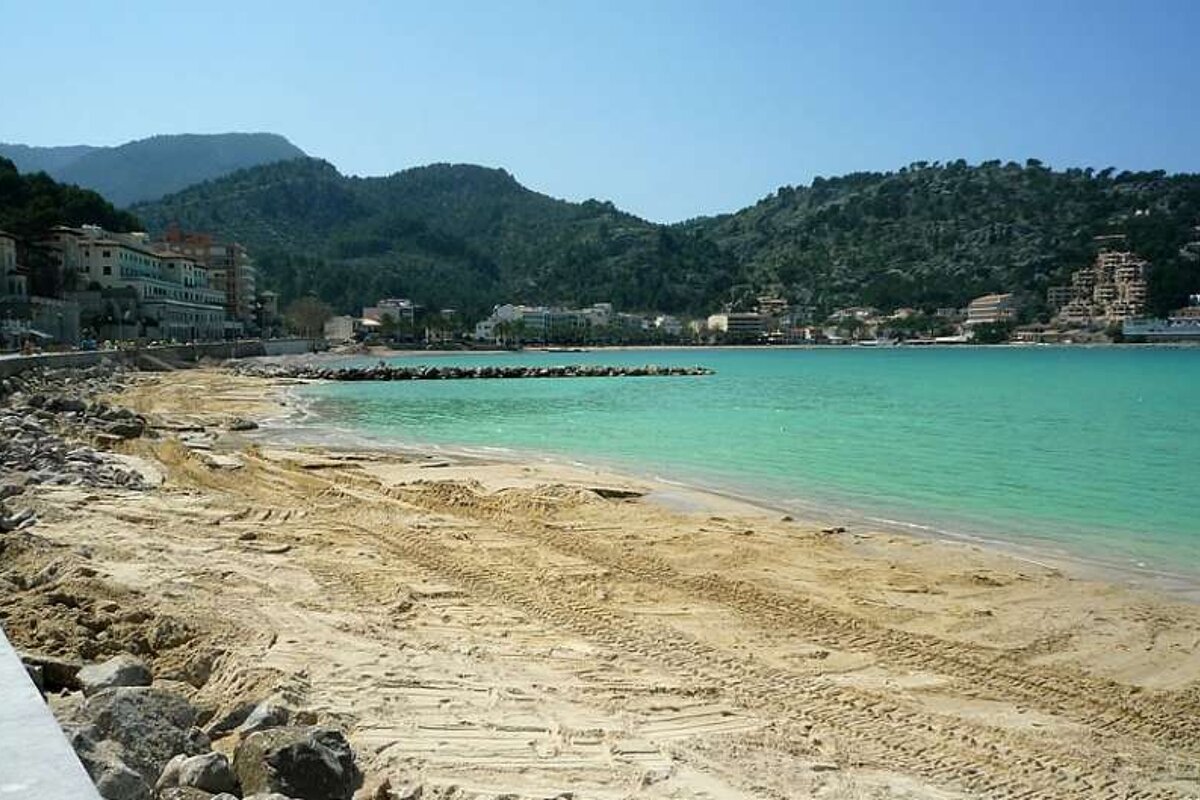 photo of new sandy beach bay with blue sea
