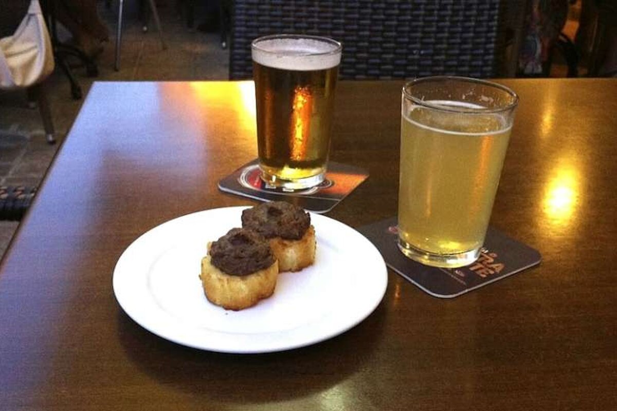 photo of tapas and a drink on a table