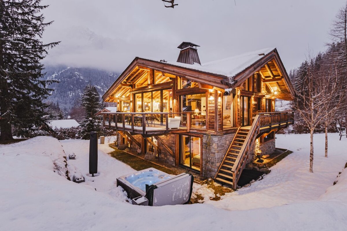 A large house with a hot tub in front of it