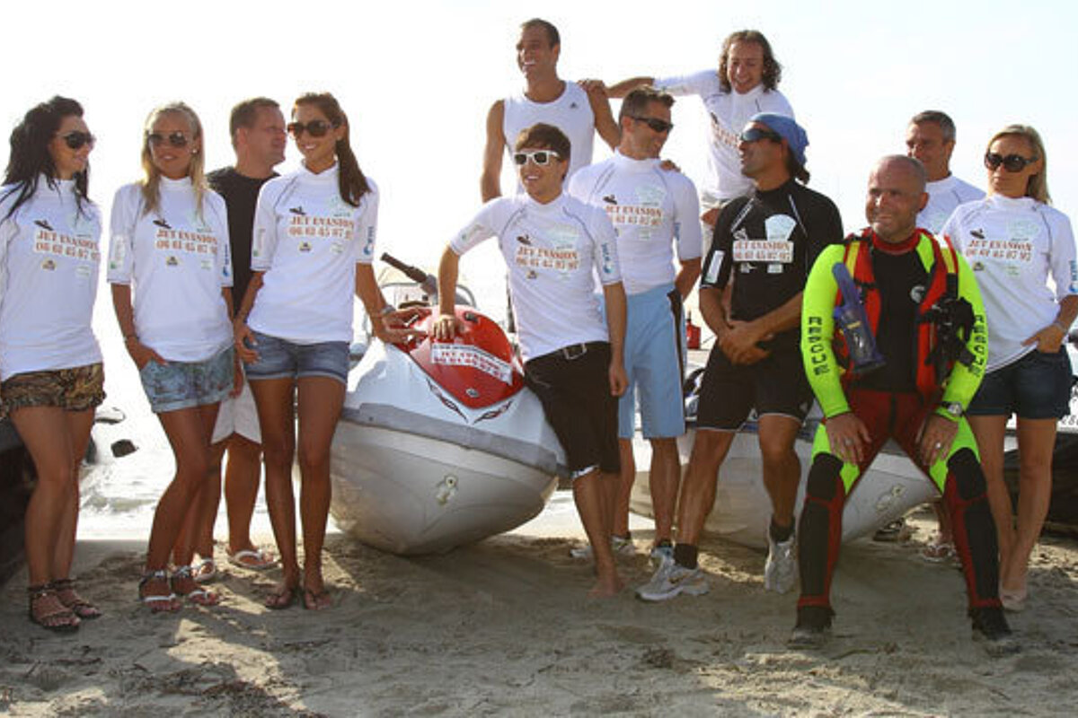 A group of people wearing shirts that say jet ski rental