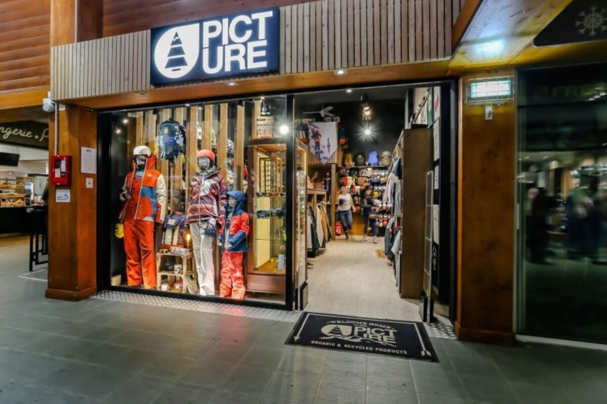 A picture ure store is located in a wooden building