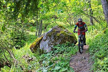 mountain biker on trails in the chamonix valley