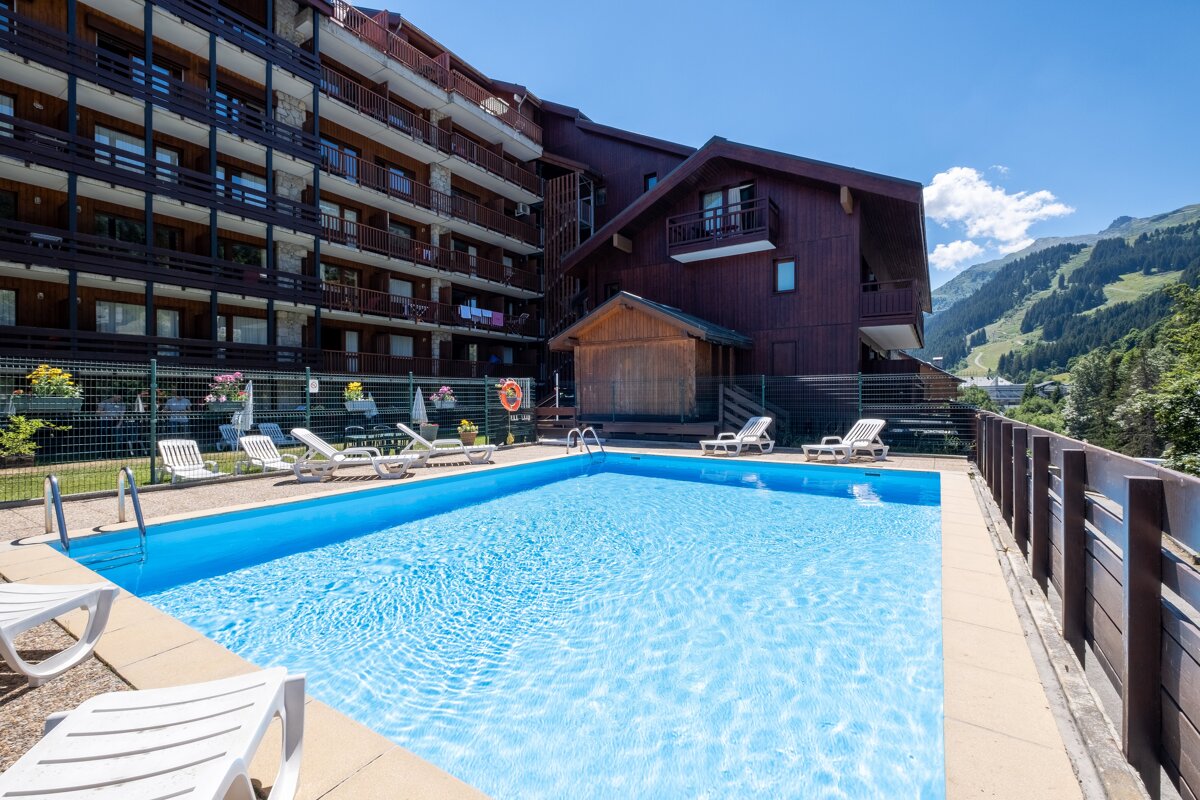 A large swimming pool in front of a building