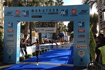 a runner crossing line of marathon 2016