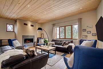 A living room filled with furniture and a fireplace