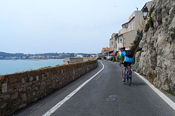 a cyclist on the road through antibes