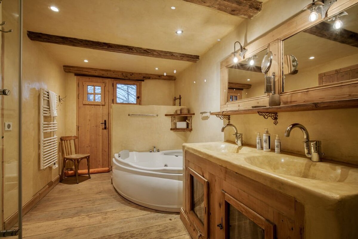 A bathroom with a jacuzzi tub and a sink