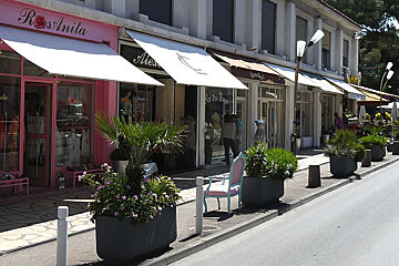a row of boutiques on a shopping street