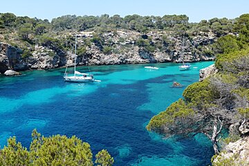 blue sea in a small cove with yachts