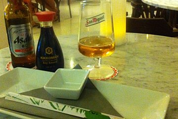 a san miguel beer and glass