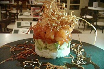 a pile of food with crispy noodles on top