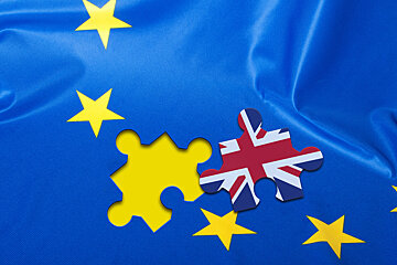an EU flag with a british flag jigsaw piece