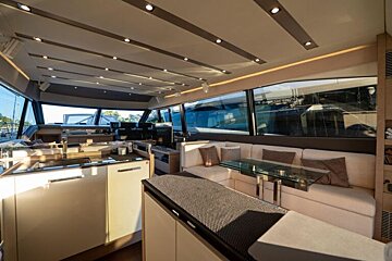 The inside of a boat with a couch and a table