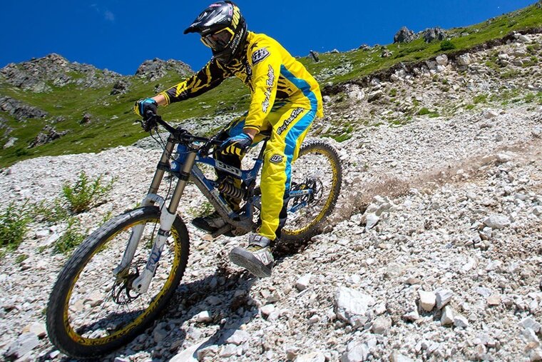 a mountain biker skidding past the photographer