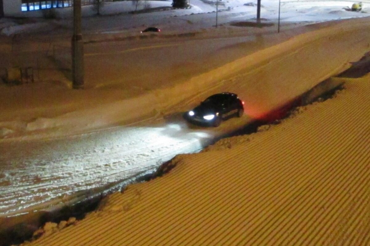a car driving an ice circuit at night