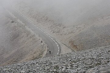 a cyclist in the low cloud in provence