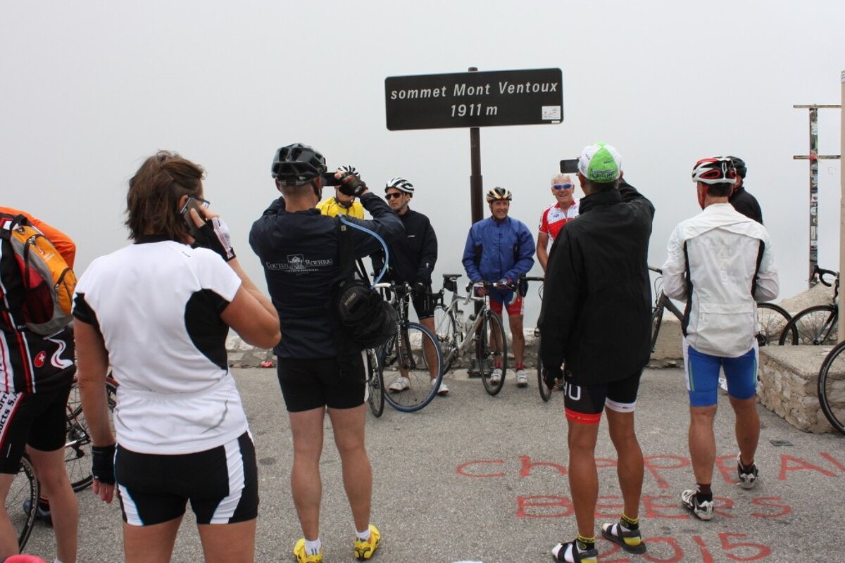 a group of cyclists at the top of mont ventoux