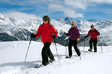 three people snowshoeing