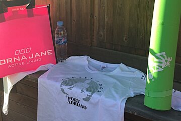 a bag, t-shirt and yoga matt