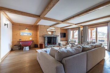 A living room with a fireplace and a couch
