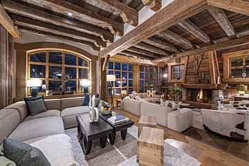 A living room filled with furniture and a fireplace