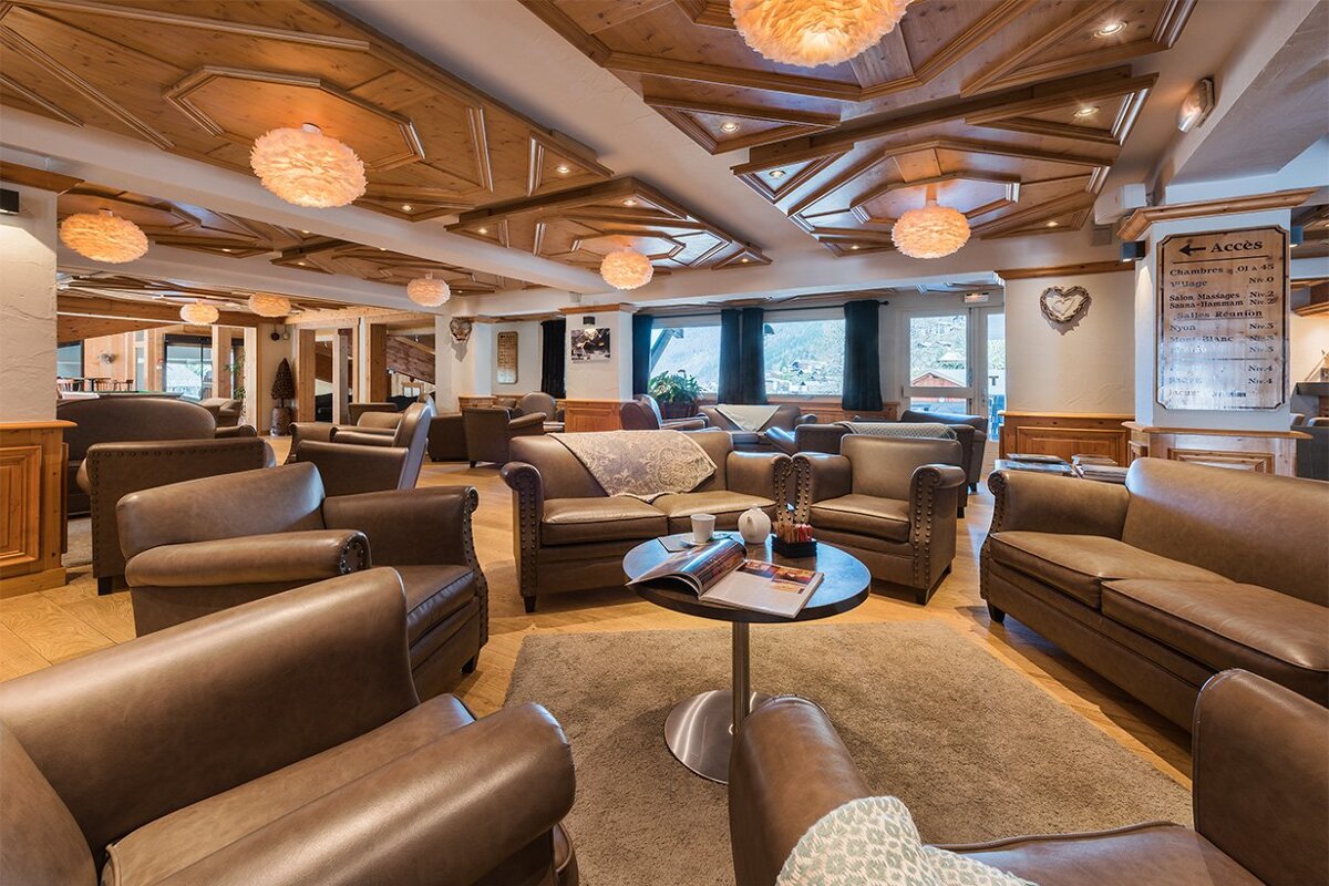 A large room with lots of furniture and a sign that says lots