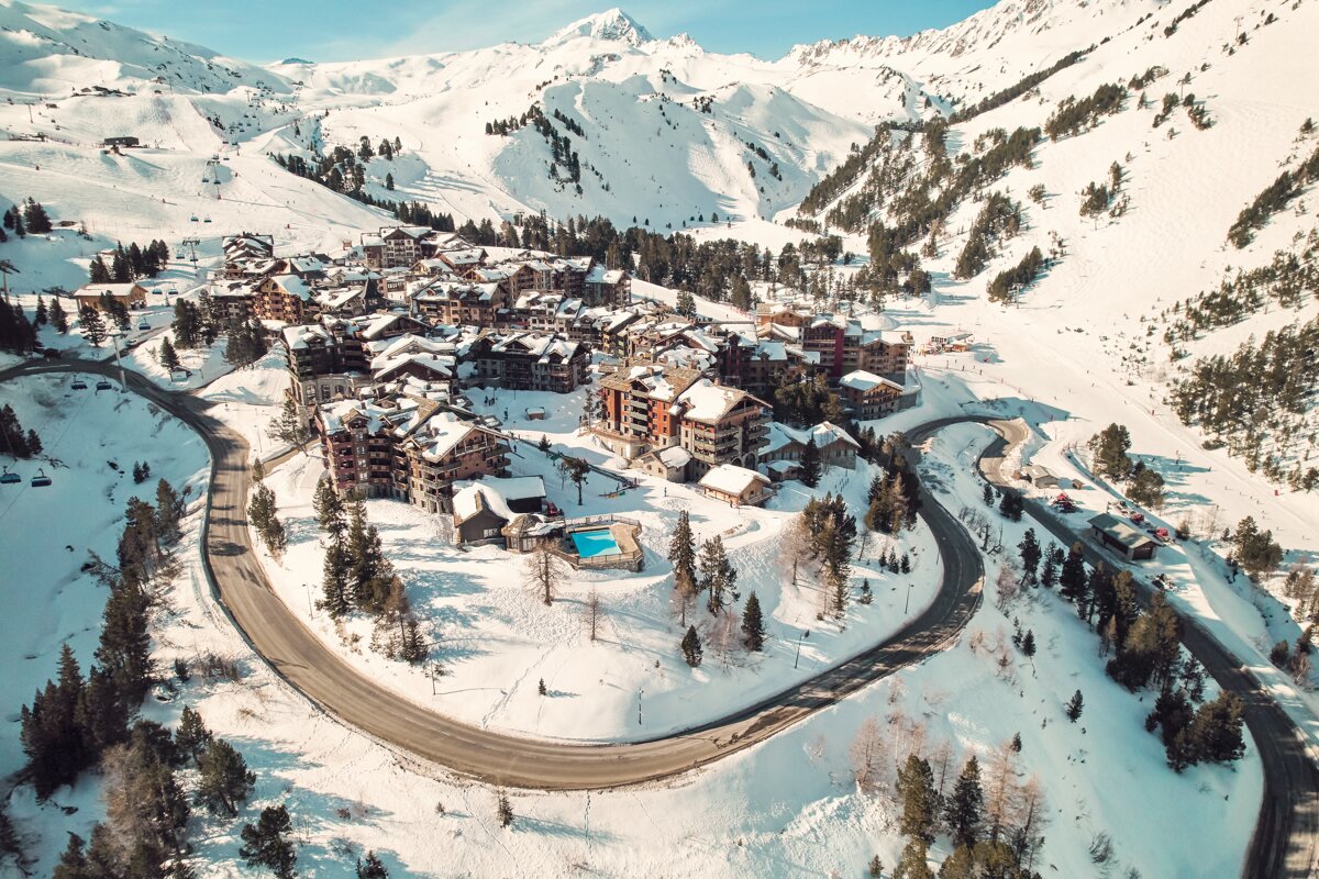 An aerial view of a snowy mountain village