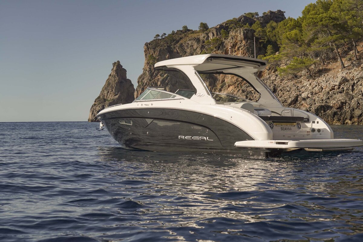 A regal boat is floating on a body of water