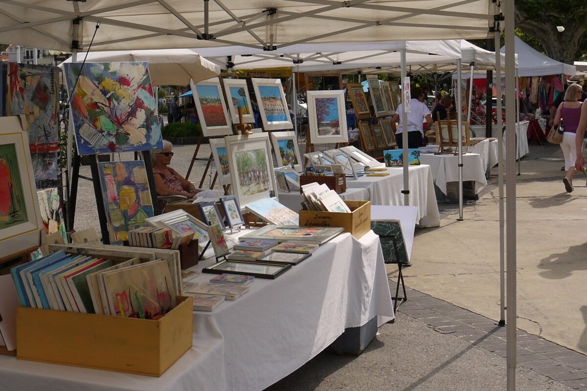 image of stalls selling paintings at a market