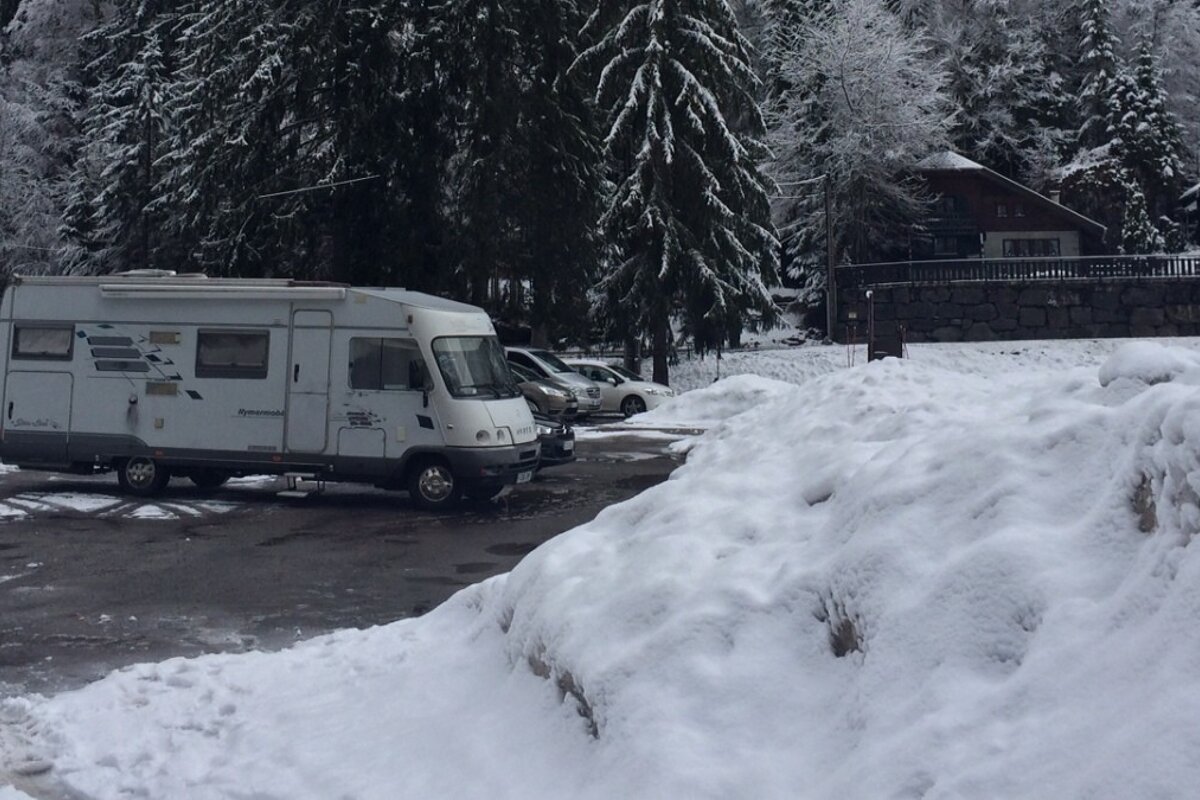 a motorhome parked in a snowy car park