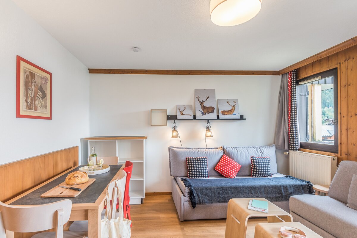 A living room with a couch and a table