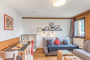 A living room with a couch and a table