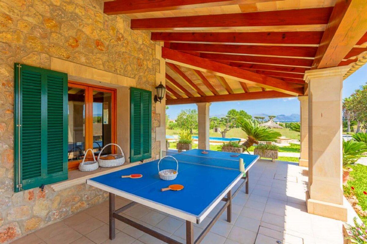 A table with ping pong balls and rackets on it