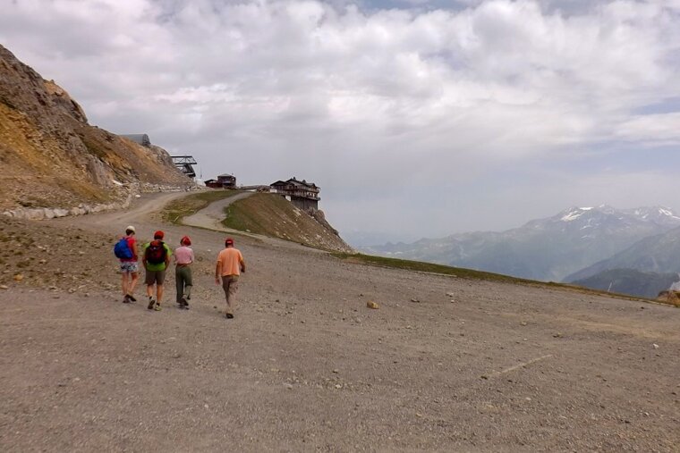 four people hiking in courchevel