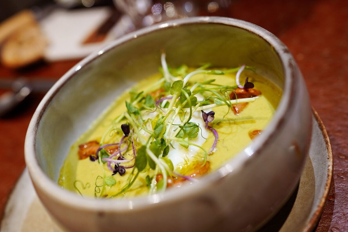 A close up of a bowl of soup on a table