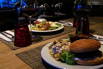 An image of dinner and red wine at a bar restaurant in chamonix mont blanc