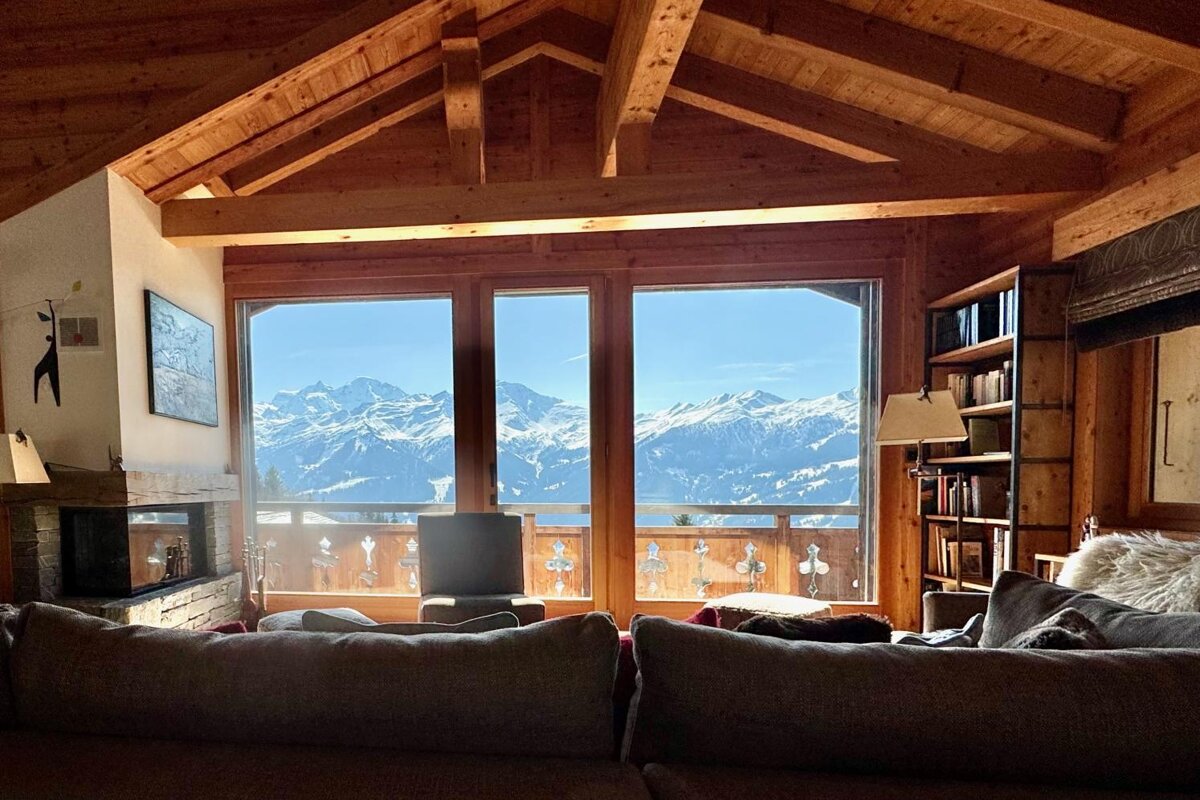 A living room with a view of the mountains