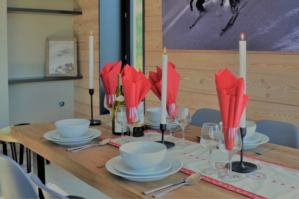 a dining table with plates & bowls