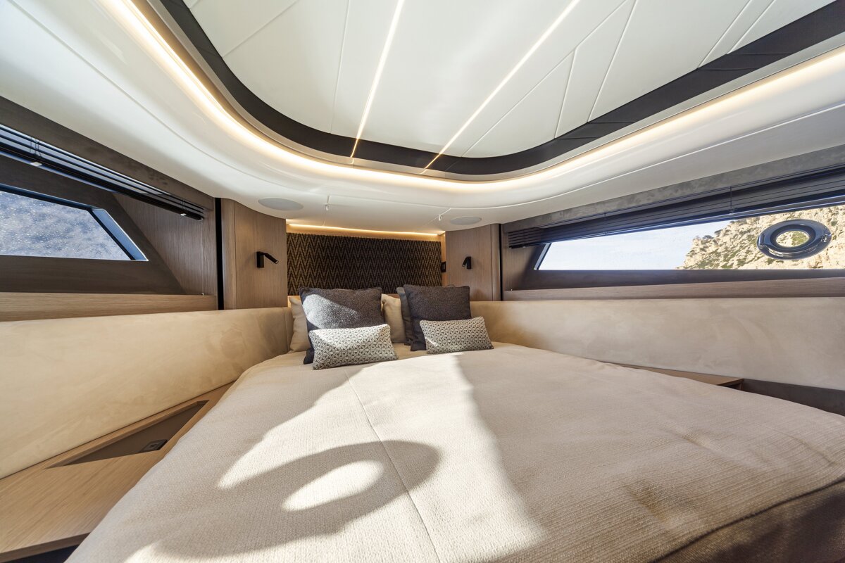 A bedroom with a large bed and a window