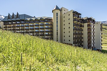 A large building with balconies on the side of it