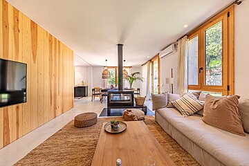 A living room with a couch and a fireplace