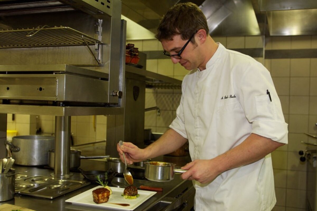 A chef in a gourmet restaurant