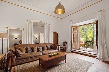 A living room with a couch and a coffee table