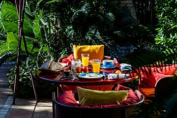A table with a variety of food and drinks on it