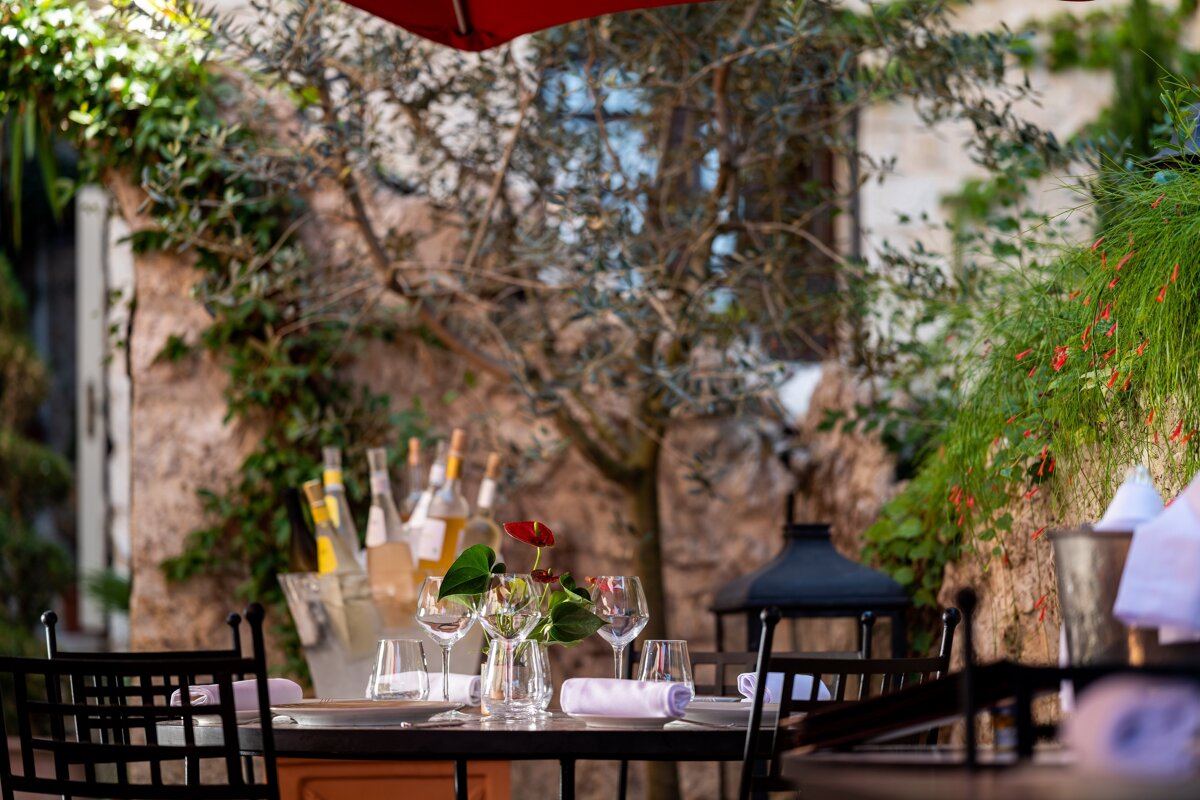 A table with a vase of flowers on it