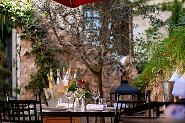 A table with a vase of flowers on it